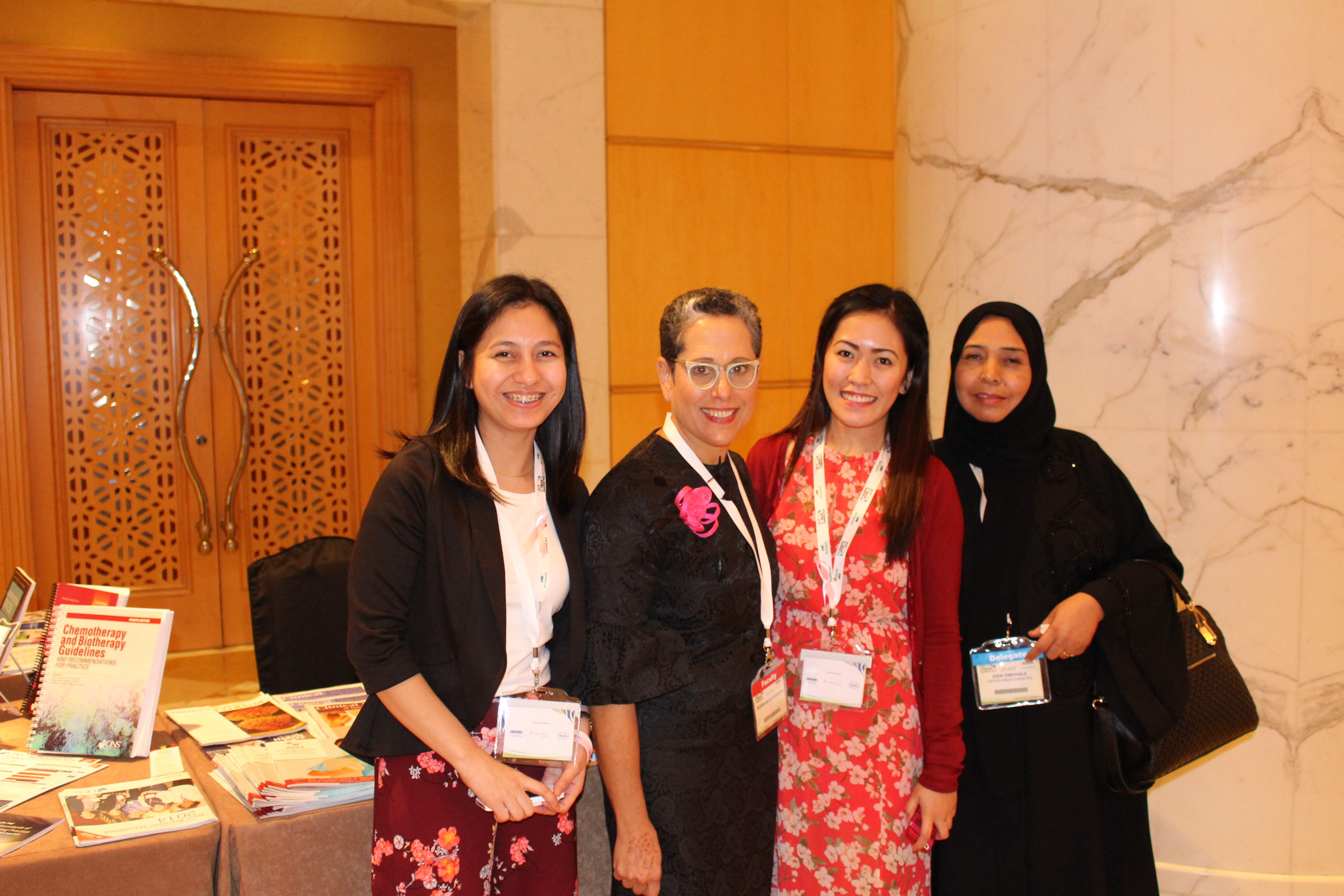 Group of professionals posing for a photo at a conference