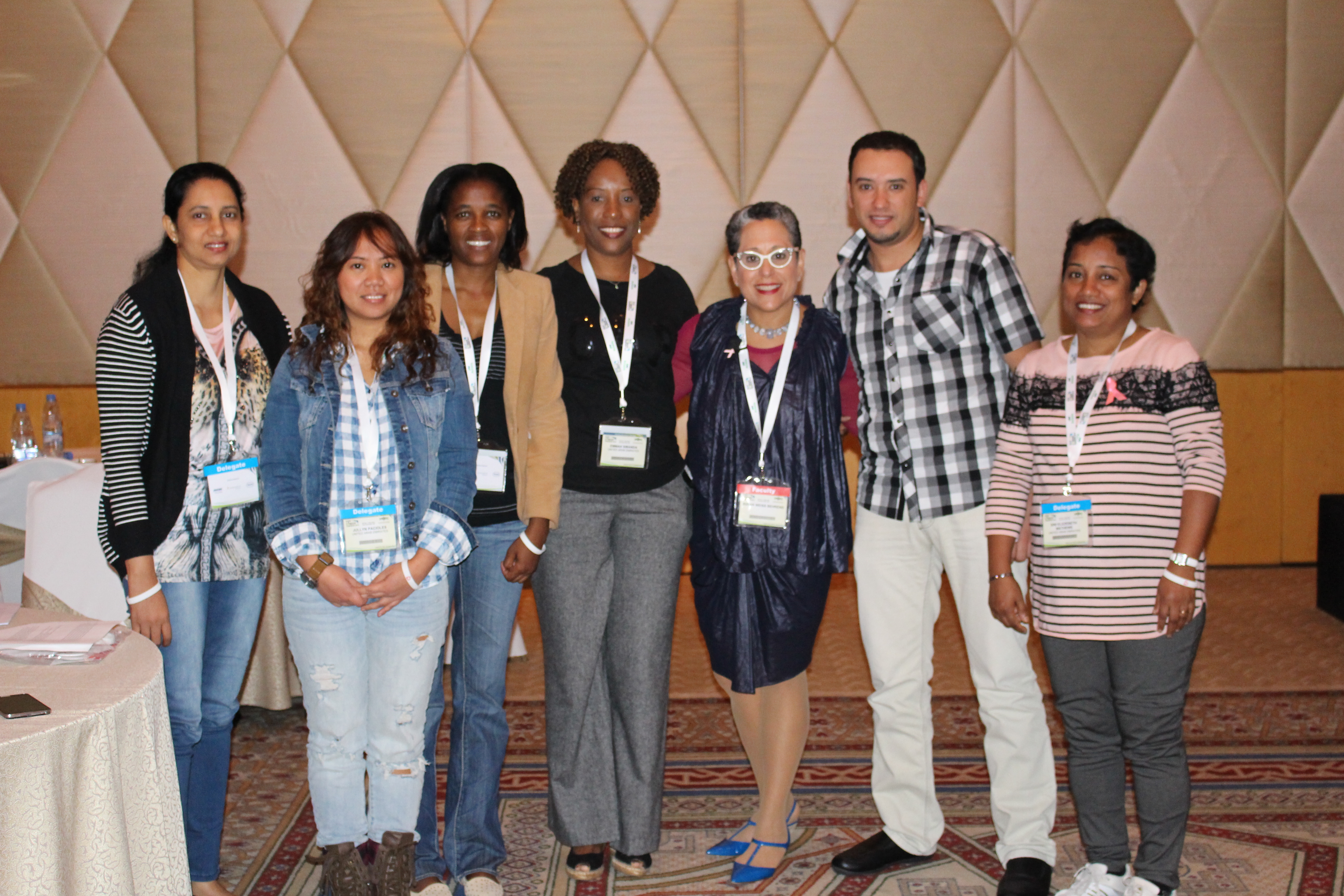 Group of professionals posing for a photo at a conference