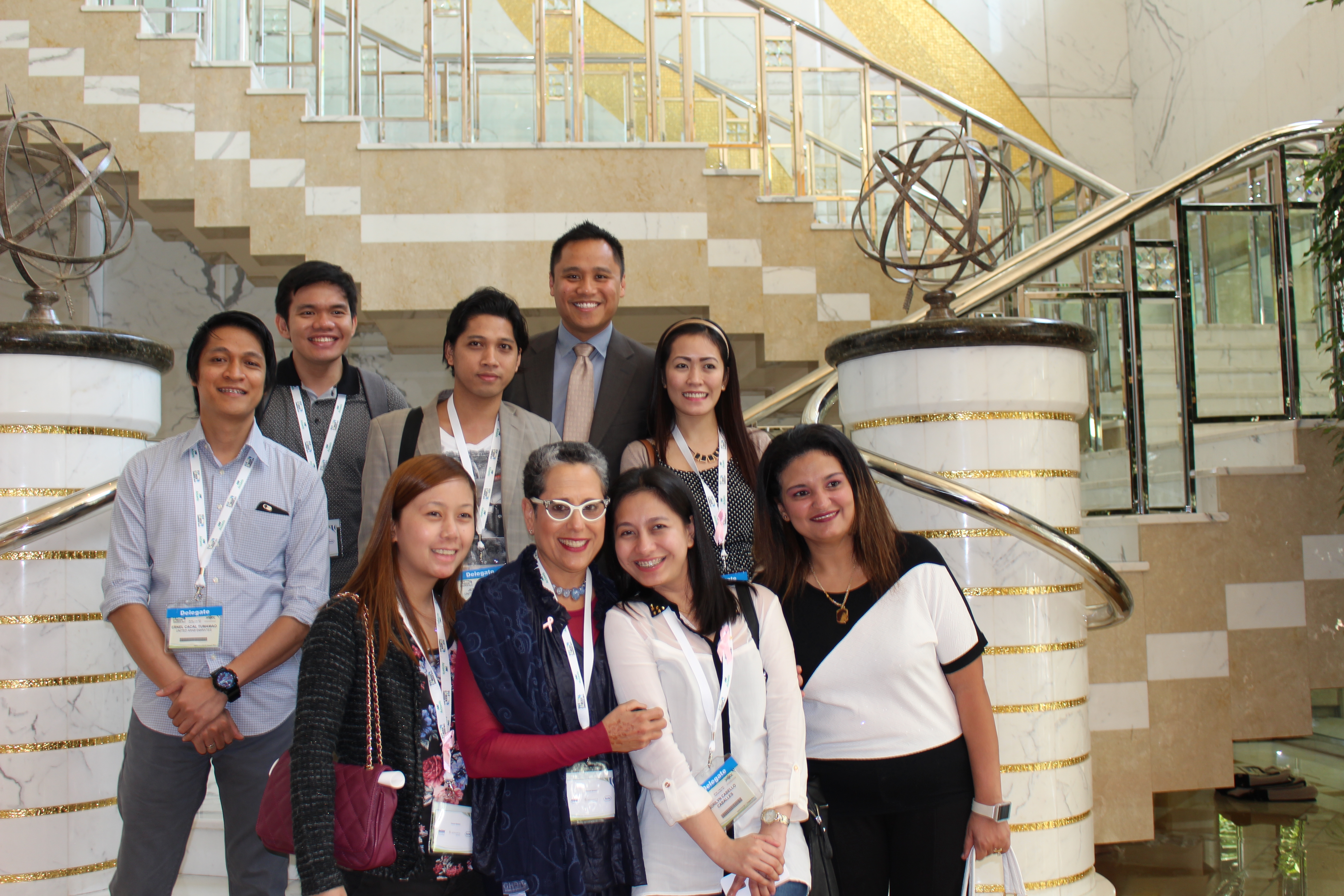 Group of professionals posing for a photo at a conference