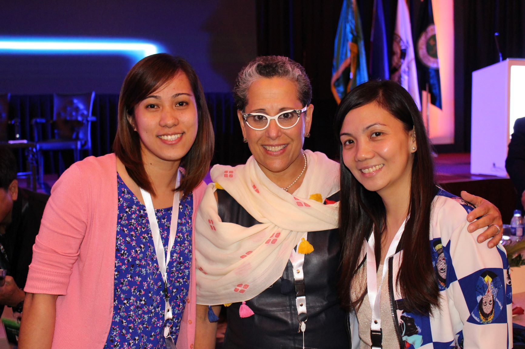 Group of professionals posing for a photo at a conference