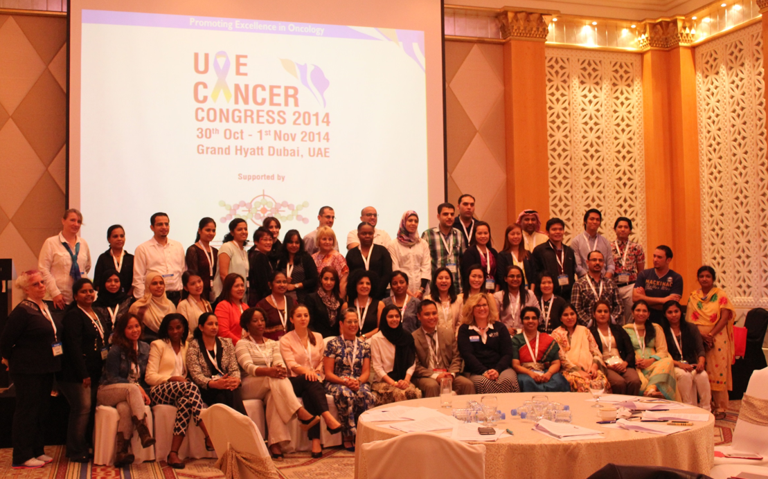 Group of professionals posing for a photo at a conference