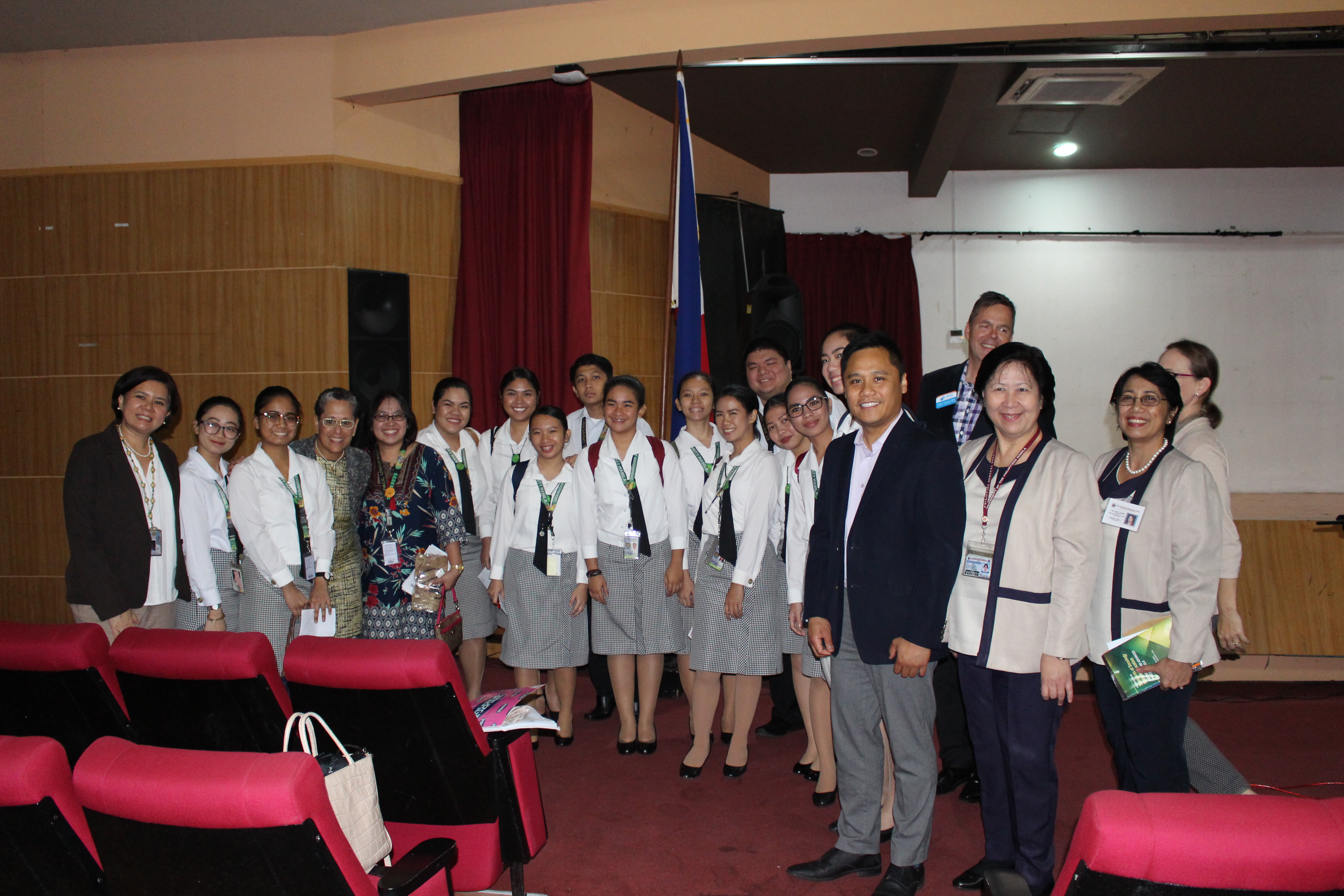 Group of professionals posing for a photo at a conference